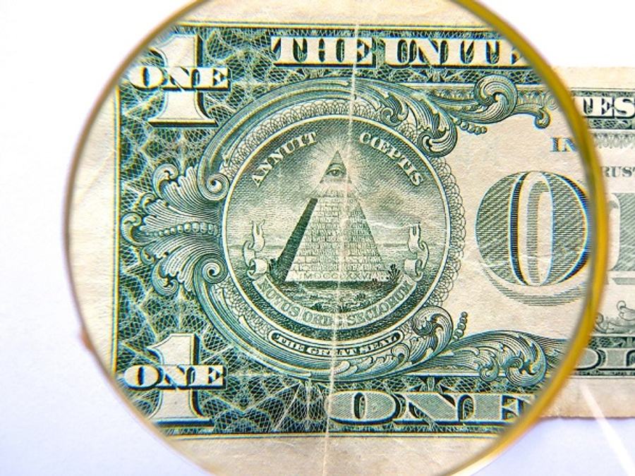 dollar and magnifying glass