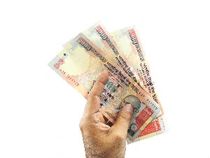 How long does it take for an NEFT transfer to get credited to an account?