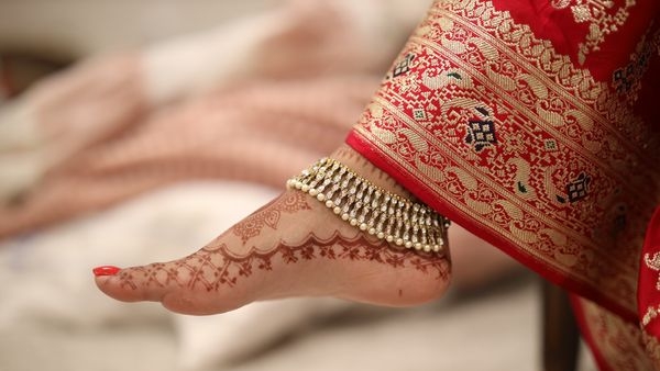 A couple consulting a financial advisor for their wedding budget A couple consulting a financial advisor for their wedding budget