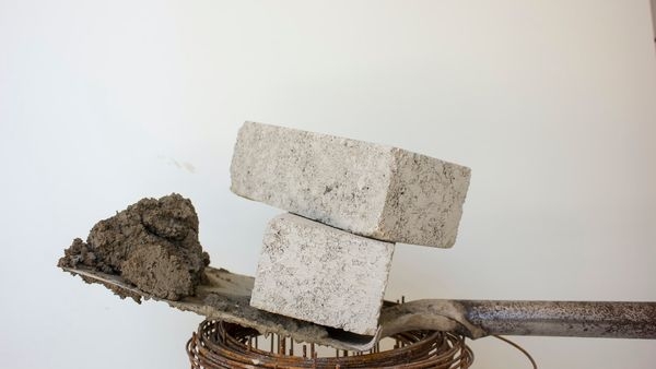 Close up of cement bags in a warehouse depicting the rise in cement price in India Close up of cement bags in a warehouse depicting the rise in cement price in India
