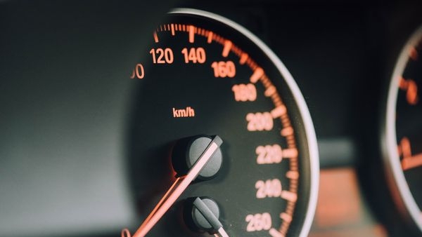 Shoppers choosing among various new cars at a dealership in Uttarakhand
