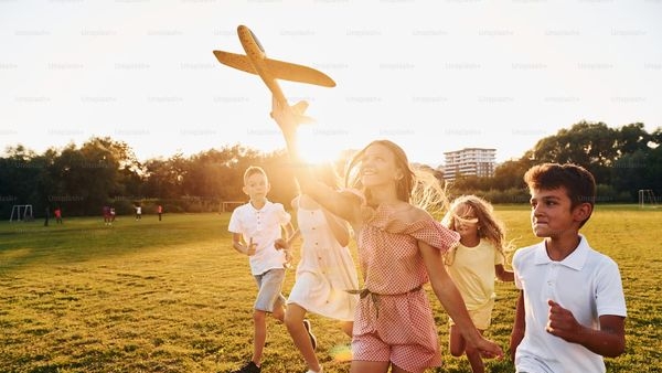Image of a child saving money in a piggy bank Image of a child saving money in a piggy bank