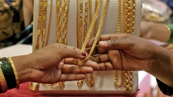 Gold and silver prices fell marginally on Friday