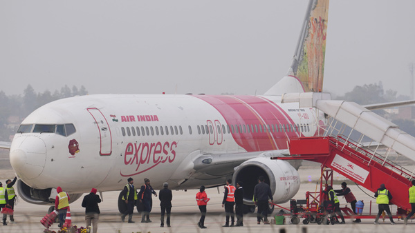Air india express layoffs 30 employees related to mass sick leave issue Tata company in turbulances