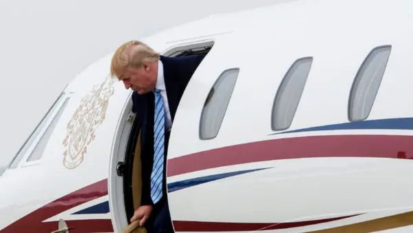 trump air force one returns to base electrical issue davos world economic forum flight emergency news 2026